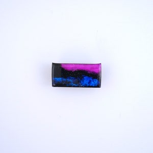 Handpainted nebula magnet set, one primarily blue and the other pink and blue covered and resin, painted in gold on the back and covered and initialled with date.