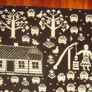 May include: A black and white textile design featuring a small house, trees, birds, and other nature-inspired motifs. The design is reminiscent of folk art and traditional patterns.