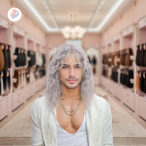 May include: A person with long, wavy, silver-gray hair and a white top. The person is wearing a gold chain necklace. The background is a store with pink walls and displays of hair extensions.