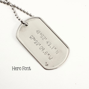 May include: Silver dog tag necklace with a heart and coordinates engraved: 41.052' 43.1" N 87.038' 09.6" W.