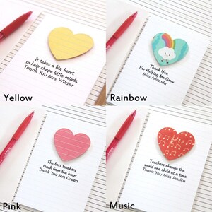 May include: Four heart-shaped sticky notes with different designs and messages. The notes are yellow, rainbow, pink, and red with musical notes. The messages on the notes are: "It takes a big heart to help shape little minds. Thank You Mrs Wilder", "Thank You For Helping Me Grow Miss Amanda", "The best teachers teach from the heart. Thank You Mrs Green", and "Teachers change the world one child at a time. Thank You Miss Jessica".
