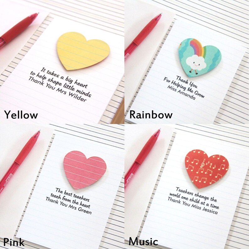 May include: Four heart-shaped sticky notes with different designs and messages. The notes are yellow, rainbow, pink, and red with musical notes. The messages on the notes are: "It takes a big heart to help shape little minds. Thank You Mrs Wilder", "Thank You For Helping Me Grow Miss Amanda", "The best teachers teach from the heart. Thank You Mrs Green", and "Teachers change the world one child at a time. Thank You Miss Jessica".