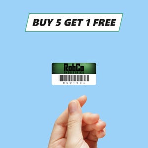May include: A green and black sticker with the text "RobCo Industries" and a barcode with the text "RCO - 0001". The sticker is floating in the air above a hand with the text "BUY 5 GET 1 FREE" in a green rectangle above the sticker.