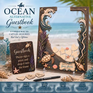 May include: A wooden drop-top guestbook frame featuring ocean-themed decorations like sea turtles, waves, and shells. Includes a matching instruction sign, wooden heart and turtle-shaped tokens, and a black pen for signing guest messages.
