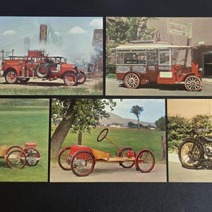 May include: A collection of vintage postcards featuring antique vehicles. The images include a red fire truck, a passenger bus, two pedal cars, and a motorcycle. The postcards are set against various backgrounds, including a grassy field and a building.