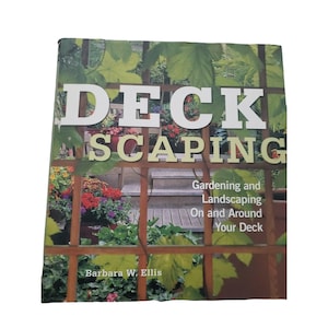 May include: A book titled "Deckscaping" with the subtitle "Gardening and Landscaping On and Around Your Deck." The cover features a wooden deck, plants, and the author's name, Barbara W. Ellis.