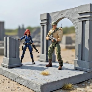 May include: Two action figures, a woman in a blue suit and a soldier in a tan shirt and green pants, stand on a gray stone platform. The soldier holds a rifle. A gray archway and pillars are in the background.