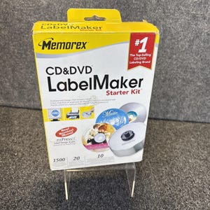 May include: A yellow and white Memorex CD & DVD LabelMaker Starter Kit box. The packaging features the text #1 The Top-Selling CD/DVD Labeling Brand, CD & DVD LabelMaker Starter Kit, and exPressit Label Design Studio. It displays images of CDs.