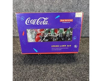 Vintage~Coca-Cola ljusslinga set~Coca-Cola flaskor/Cirkel Coca-Cola logotyp~I låda Aldrig använd