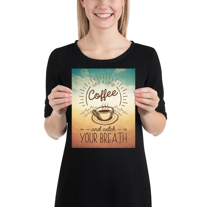 May include: A vintage-style poster with a brown coffee cup and steam rising from it. The text reads "Have a cup of Coffee and catch your breath". The background is a gradient of blue, yellow, and orange.