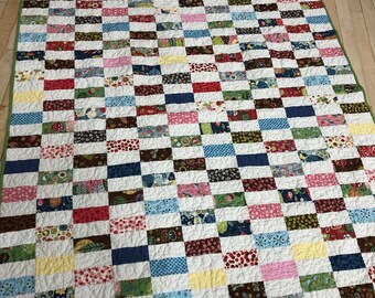 Baby or Lap Quilt --  coins —  green, blue, pink, brown, red, cream, yellow