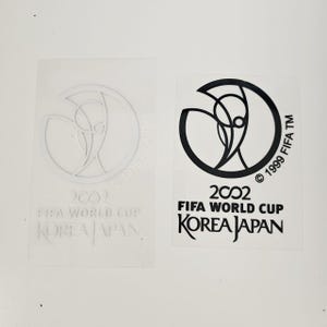 Toppa termoadesiva della Coppa del Mondo FIFA 2002 Corea Giappone - Maglia da calcio retrò da applicare sulla manica.