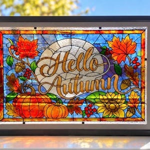 May include: A rectangular stained glass panel in a black frame featuring the text Hello Autumn in gold script. The design includes orange pumpkins, red maple leaves, yellow sunflowers, brown acorns, and red berries against a blue background.