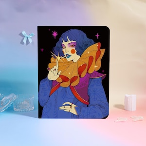 May include: A black notebook featuring a colorful illustration of a person with blue hair, a large orange and red collar, and a blue outfit. The person is pointing a finger with a sparkling star. The background is black with pink stars.