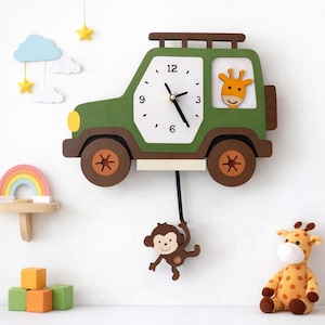 May include: A green and brown wooden wall clock shaped like a jeep. The clock face is white with black numbers and hands. A giraffe is in the window. A monkey hangs from the pendulum. The clock is decorated with a rainbow, clouds, and stars.