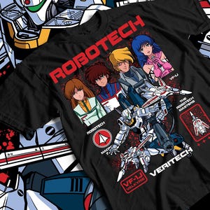 May include: Black t-shirt featuring a graphic of characters and a Veritech fighter from the Robotech anime series. The shirt includes the text "ROBOTECH", "VF-1J VALKYRIE", and "VERITECH". The design has a retro anime style.