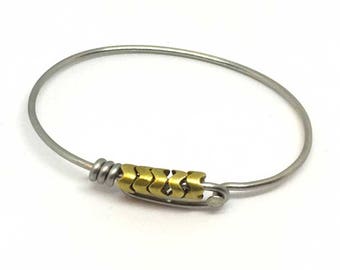 Bicycle spoke bracelet with brass accent