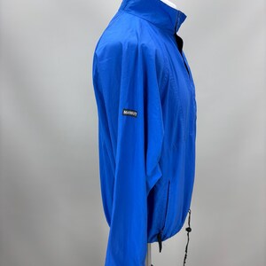 May include: A white ceramic mug with a black handle and the text "But First, Coffee" in a black, bold font. The mug is on a white surface.