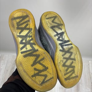 May include: A set of three ceramic mugs with a speckled, matte finish. The mugs are in shades of cream, light gray, and dark gray. Each mug has a simple, minimalist design, perfect for coffee or tea.