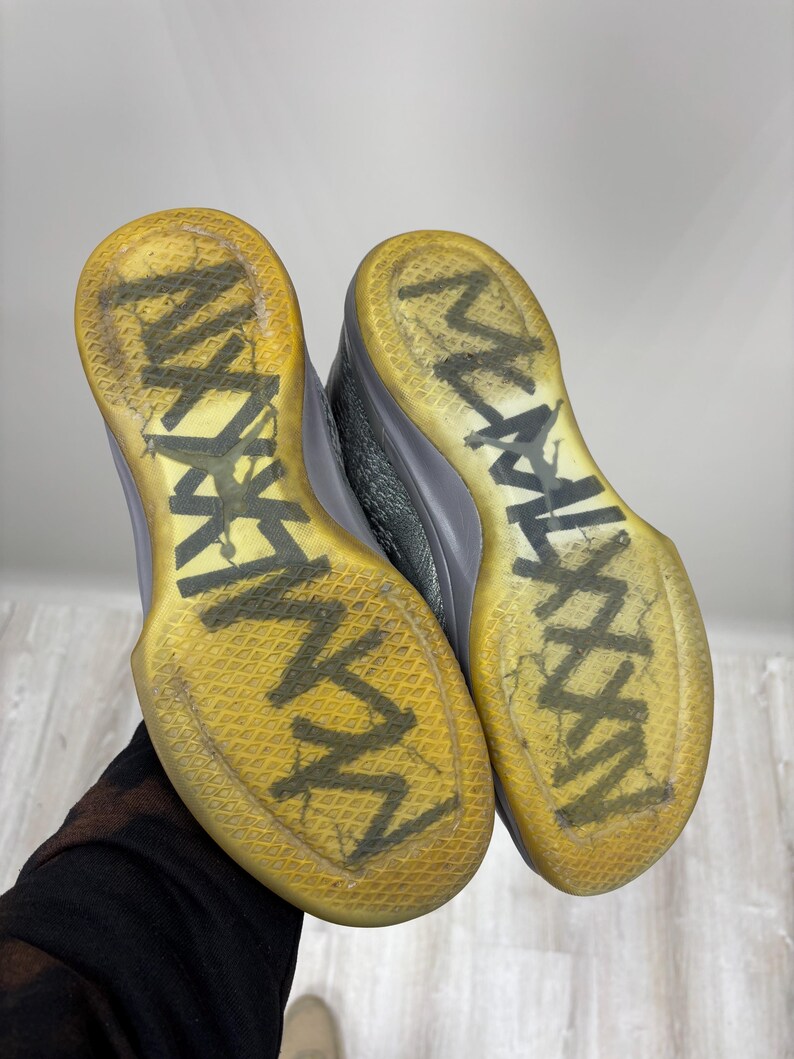 May include: A set of three ceramic mugs with a speckled, matte finish. The mugs are in shades of cream, light gray, and dark gray. Each mug has a simple, minimalist design, perfect for coffee or tea.