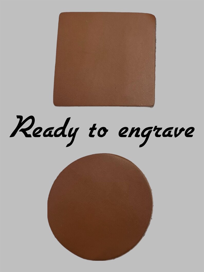 May include: Two brown leather coasters, one square and one round, are displayed against a light gray background. The text "Ready to engrave" is written in black script below the square coaster and above the round coaster.