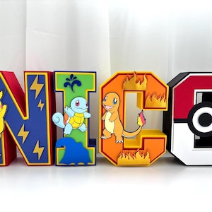 May include: Bright 3D letters spelling "NICO" featuring Pokémon characters. The letters are red, blue, green, orange, and black, with yellow lightning bolts and Pokémon figures like Pikachu, Squirtle, and Charmander. The letter "O" is designed as a Pokéball.