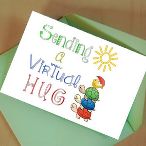 May include: A white card with a green envelope. The card says "Sending a Virtual HUG" with a sun and three turtles stacked on top of each other.