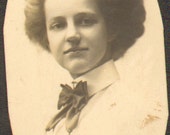 ON SALE Antique Photo of a Woman Wearing a Blouse with Large Bow Tie and She Has a Bouffant Hair Do