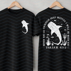 May include: Black t-shirt with a white whale shark graphic on the front and back. The back of the shirt features the text "When you go through deep waters, I will be with you. Isaiah 43:2."