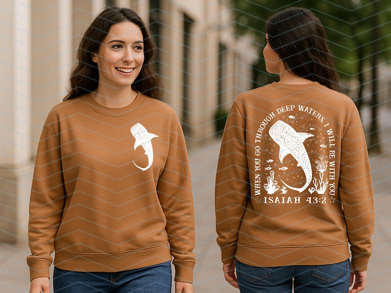 May include: A brown sweatshirt with a white whale shark graphic on the front and back. The back of the sweatshirt has the text "WHEN YOU GO THROUGH DEEP WATERS, I WILL BE WITH YOU" and "ISAIAH 43:2".