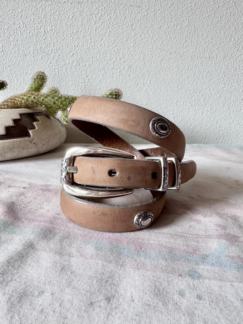 May include: A rustic wooden sign with the text "Welcome to our home" in a handwritten style. The sign has a distressed finish and a simple, inviting design, suitable for a front porch or entryway.