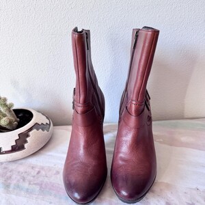 May include: A set of three ceramic mugs with a speckled, matte finish. The mugs are in shades of cream, light gray, and dark gray. Each mug has a simple, modern design and a rounded handle.