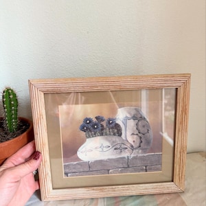 Vintage 1989 Southwest Cactus with Pottery on a brick Wall Framed Print.
