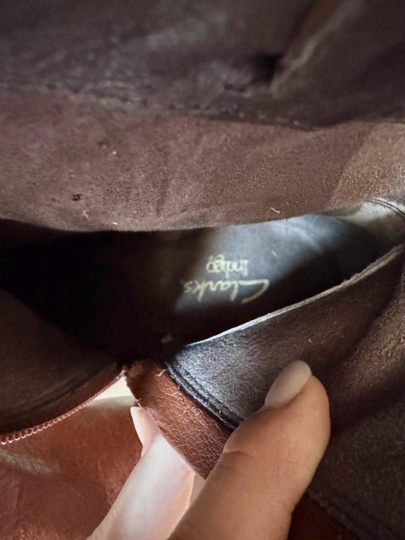 May include: A rustic wooden sign with the text "Welcome to our home" in white lettering. The sign features a distressed finish and a simple, inviting design, perfect for entryway decor.