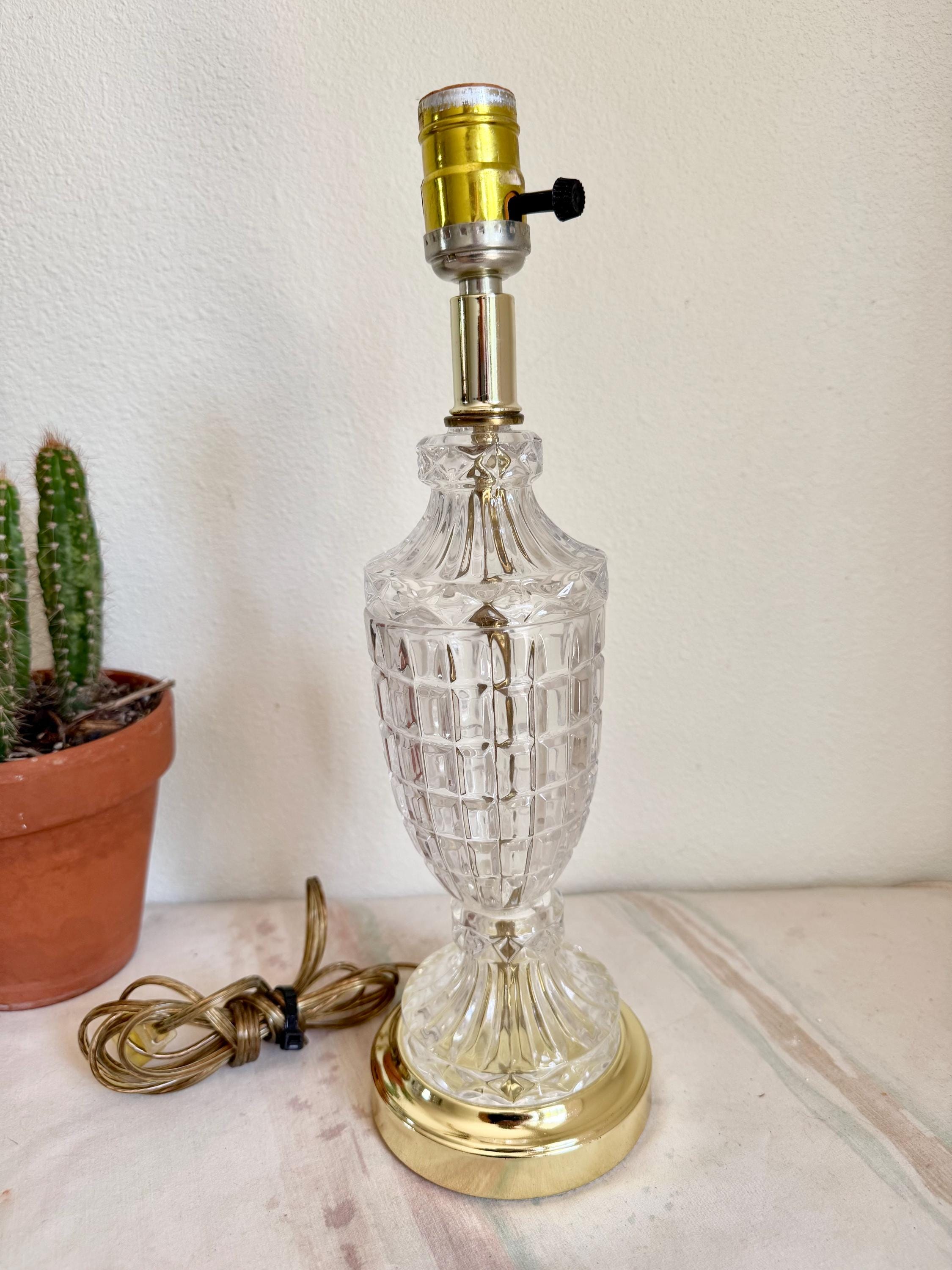 Sold at Auction: 2 Vintage Cut Crystal Table Lamps - each with a brass  fittings and cream shade, both in working order. Tallest 77cm high., image size:2250x3000
