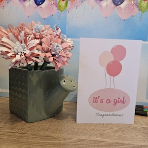 Tarjeta de felicitación de felicitaciones por el nacimiento de tu niña.
