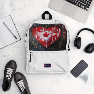 Sac à dos blanc avec drapeau canadien - Sac de voyage et d'école durable avec un design élégant en feuille d'érable, léger et spacieux pour un usage quotidien