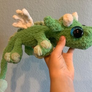 Cute crochet amigurumi green dragon