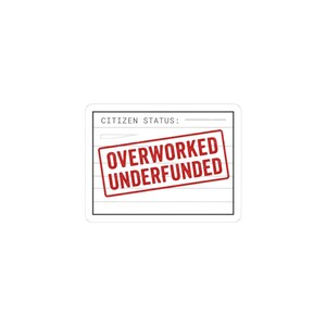 May include: A white sticker with the text "CITIZEN STATUS:" at the top. A red rectangle stamp reads "OVERWORKED UNDERFUNDED" over the lined paper design. The sticker has a white border.