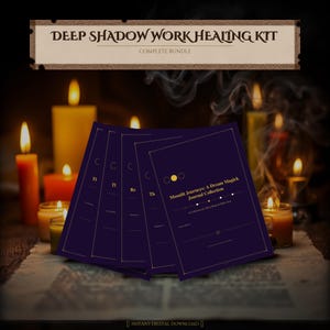 May include: A complete bundle of a Deep Shadow Work Healing Kit. The image shows a stack of dark purple journals with gold accents and the text "Moonlit Journeys: A Dream Magick Journal Collection". Lit candles and the text "Deep Shadow Work Healing Kit" are also visible.