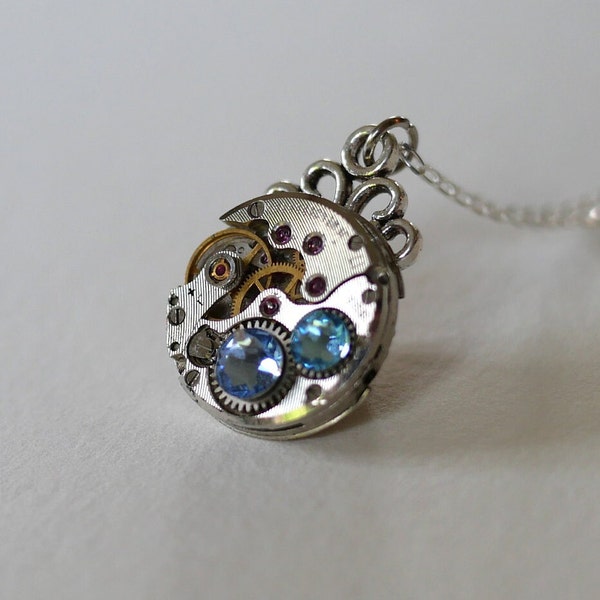 Pendant Old watch movement from the 50s and light blue Swarovski