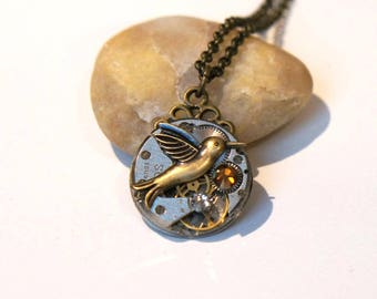 Pendentif Ancienne montre Swarovski bronze, diamant et colibri en laiton