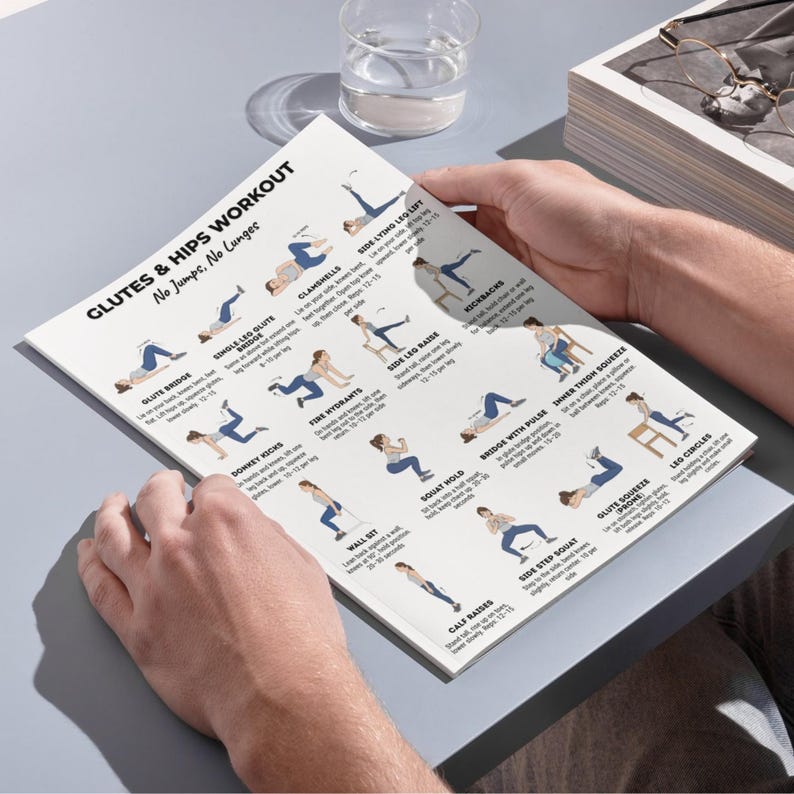 May include: A white printed workout guide titled "Glutes & Hips Workout No Jumps, No Lunges." The guide features illustrated exercises, including glute bridge, clamshells, and side leg raises. The guide is held by a person.