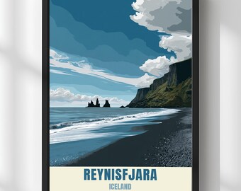 May include: Framed art print featuring a coastal landscape with a black sand beach, ocean waves, and dramatic cliffs under a blue sky with white clouds. The print includes the text "REYNISFJARA ICELAND" in a white rectangle.