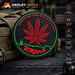 May include: A circular black PVC patch featuring a red cannabis leaf at the centre, a green city skyline silhouette, and the red text BRIGADE DES STUPEFIANTS and BORDEAUX. The patch has a green border and 3D raised details throughout.