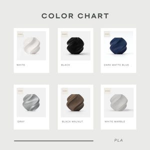 May include: Color chart showing different colors of PLA filament for 3D printing. The colors include white, black, dark matte blue, gray, black walnut, and white marble.