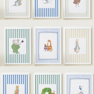 May include: Nine framed art prints featuring whimsical animal illustrations. Each print has a white border and is set against a striped background in various colors. The illustrations include a mouse, elephant, tiger, and rabbit.
