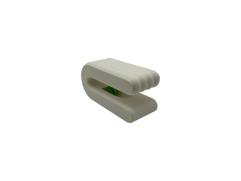 May include: A white, U-shaped object with a ribbed top and a smooth base. The design features a curved form with a space in the middle. The object appears to be made of a solid, matte material.
