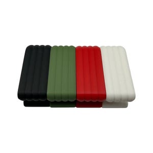 May include: Four rectangular silicone watch bands in black, olive green, red, and white. Each band has a ribbed texture and a curved bottom edge. The bands are arranged side by side against a white background.
