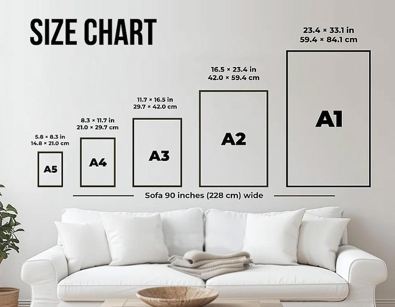 Op de afbeelding: Een maattabel toont afmetingen voor A5, A4, A3, A2 en A1 papierformaten, met metingen in inches en centimeters. De tabel staat op een witte muur, boven een witte bank van 228 cm breed.